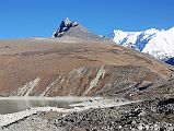 Gokyo 4 Nameless Fangs 1 Full View From Edge Of Fourth Lake North of Gokyo The trail from Gokyo up the valley is fairly easy, taking about an hour to Tonak (4840m), the fourth Gokyo lake. In 2000, I ascended the right most of the Nameless Fangs (5600m).